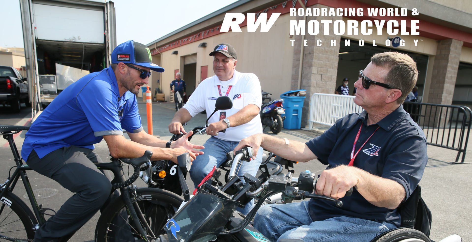 MotoAmerica President Wayne Rainey (right), MotoAmerica Chief Operating Officer Chuck Aksland (center), and four-time AMA Superbike Champion Josh Hayes (left) during a MotoAmerica event at Sonoma Raceway in 2018. Photo by Brian J. Nelson.