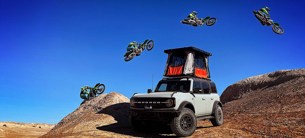 Road racer, crew chief, and rider coach Jeremy Toye jumps a Kawasaki KX450 over a deployed Recon model Bad Ass Tent in this promotional photo. Photo courtesy Bad Ass Tents.