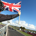 The starter displays the Union Jack, the national flag of the United Kingdom, to the British Superbike field at Snetterton. Photo courtesy MSVR.