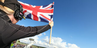 The starter displays the Union Jack, the national flag of the United Kingdom, to the British Superbike field at Snetterton. Photo courtesy MSVR.