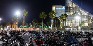 A view of the motorcycle parking area at the American Flat Track (AFT) Daytona Short Track I at Daytona International Speedway, 2023.