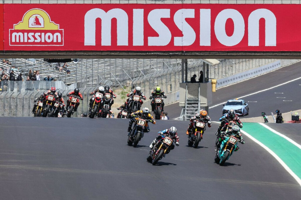 Jeremy McWilliams (99) and Stefano Mesa (137) lead the Mission Super Hooligan National Championship race over turn one. McWilliams would go on to take his second straight class victory on Sunday. Photo by Brian J. Nelson.