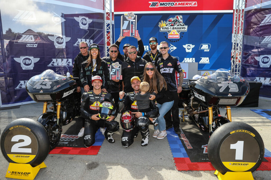 James Rispoli (kneeling left) and Hayden Gillim (kneeling right) in victory circle with their team following King Of The Baggers Race One. Photo by Brian J. Nelson, courtesy Harley-Davidson.