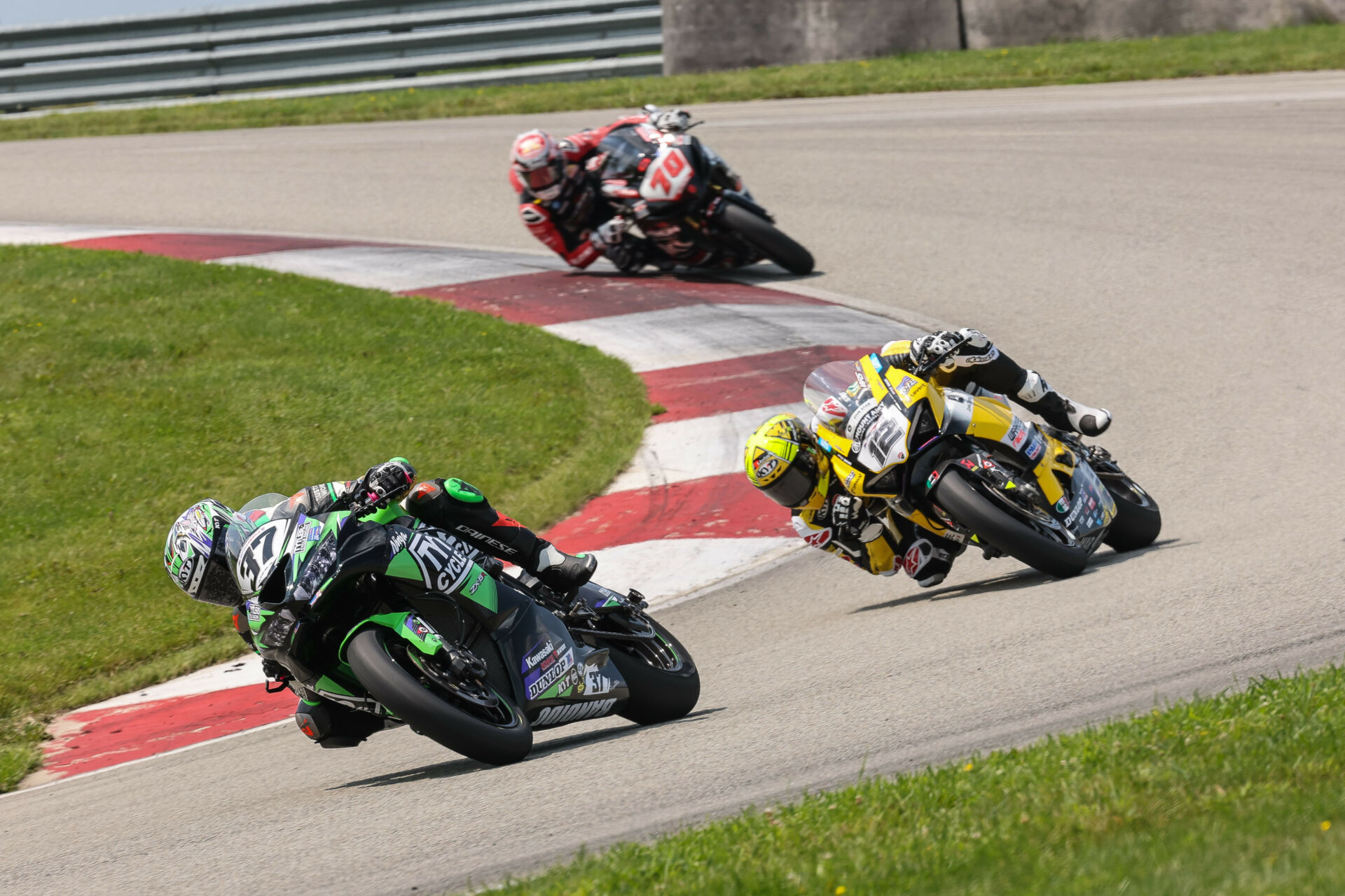 Stefano Mesa (37) leads Xavi Forés (12) and Tyler Scott (70) en route to winning Saturday's Supersport race. Photo by Brian J. Nelson.