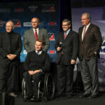 KRAVE Group/MotoAmerica partners Terry Karges (far left), Chuck Aksland (second from left), Wayne Rainey (center), and Richard Varner (far right) with AMA President Rob Dingman (second from right) at the 2018 MotoAmerica awards banquet at Barber Motorsports Park. Photo by Brian J. Nelson.