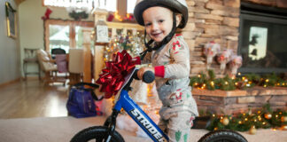 A future rider with a Strider 12 Sport balance bike. Photo courtesy Strider Bikes.