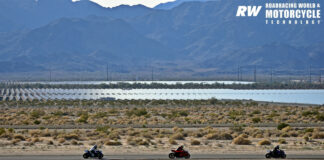 Riders at a track day at Chuckwalla Valley Raceway against a backdrop of a vast array of solar panels. With solar power generation on the rise, these land uses are compatible with racetracks and can protect them from the encroachment of developments that are not friendly to circuits. Photo by Michael Gougis.