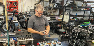 James Compton assembles a big-bore Kawasaki engine for one of his customers. Customer bikes in various stages of build can be seen in the background along with shop equipment, like the injector cleaner/flow tool over Compton’s right shoulder. Photos by David Swarts.