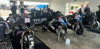 The Tytlers Cycle Racing MotoAmerica Superbike team and its BMW M 1000 RR Superbikes set up in a garage at Homestead-Miami Speedway. Team Manager/Crew Chief Dave Weaver can be seen at the far right. Photo by Steve Guanche.