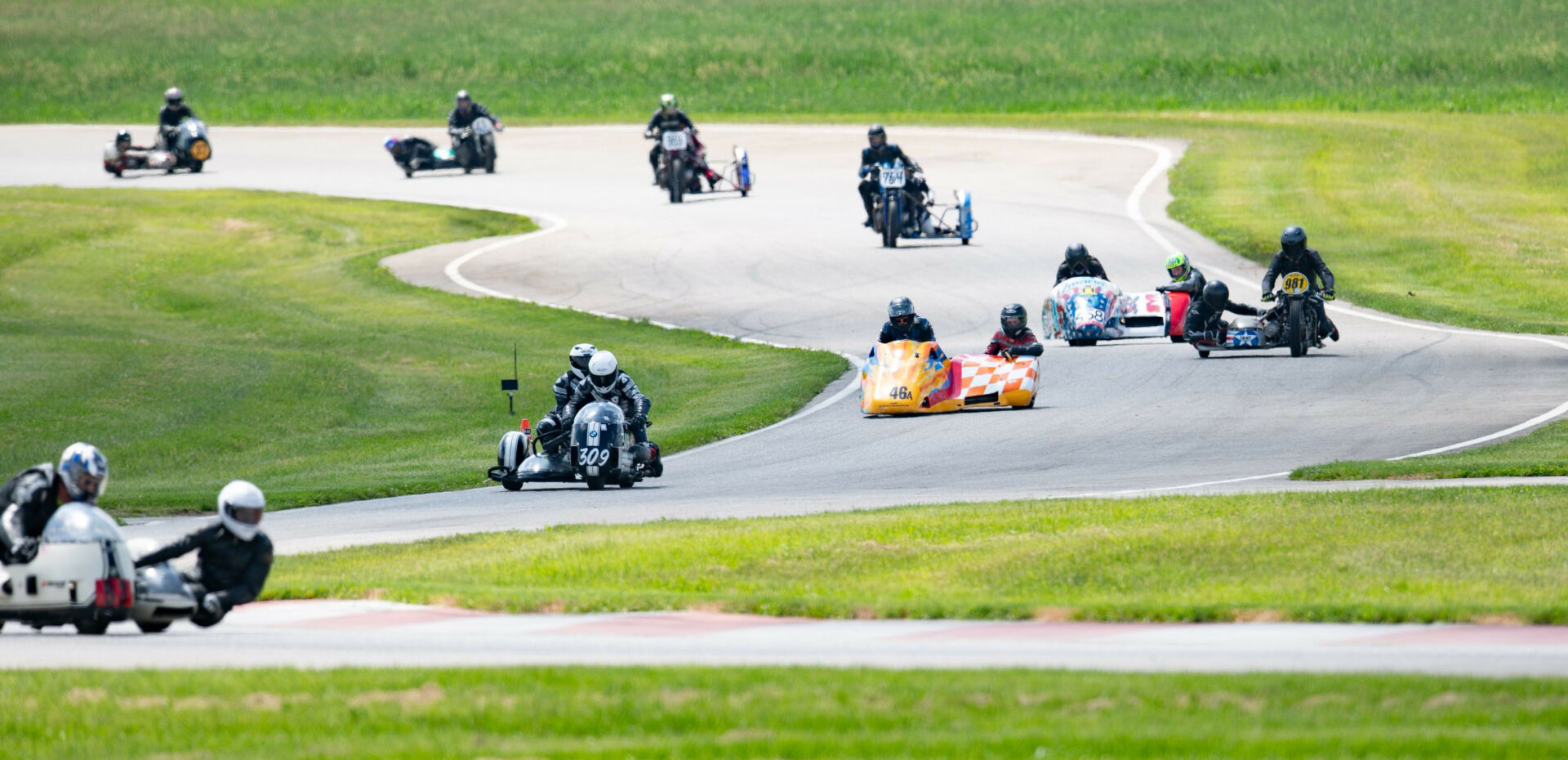 Pilot Daniel May and passenger Craig Chawla (93) lead a combined sidecar race at the AHRMA event at Nelson Ledges. Photo by Cathy Drexler, courtesy AHRMA.