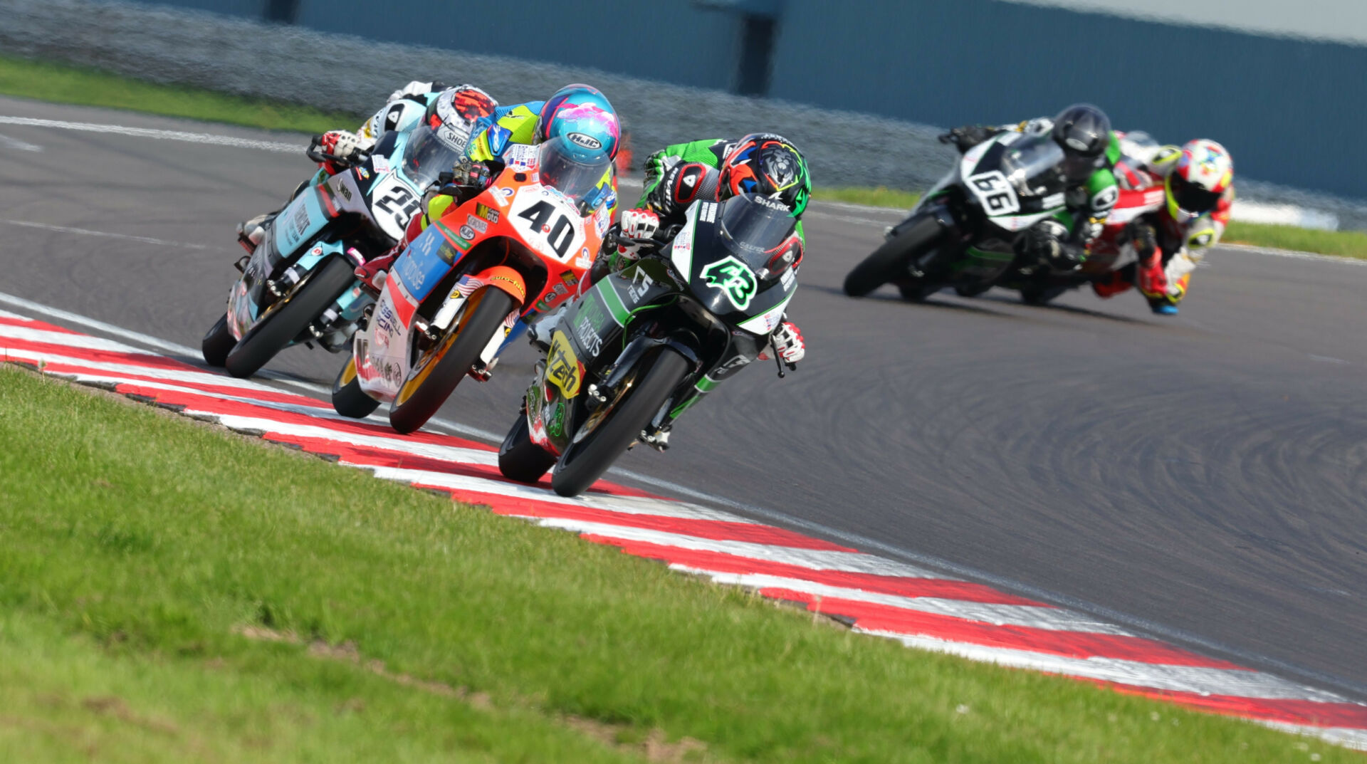 Amanuel Brinton (43) leads Julian Correa (40) and Lucas Brown (29) during British Talent Cup Race One at Donington Park. They finished the race in this order with just 0.3 second separating them. Photo courtesy Dorna.