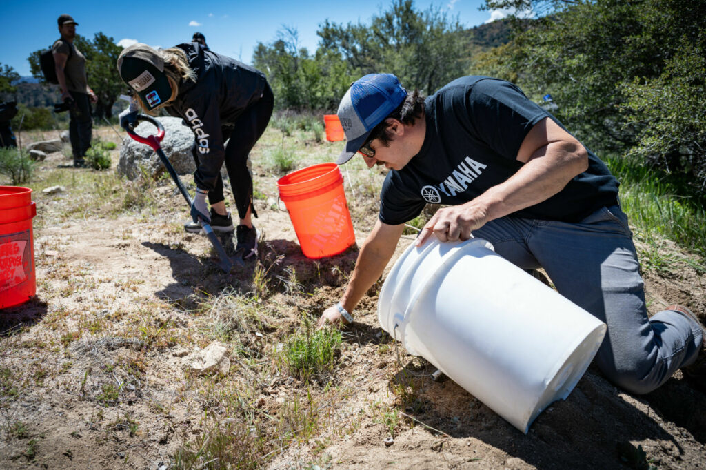 Volunteers performed a number of maintenance chores, including weeding and watering native vegetation. Photo courtesy Yamaha Motor Corp., U.S.A.