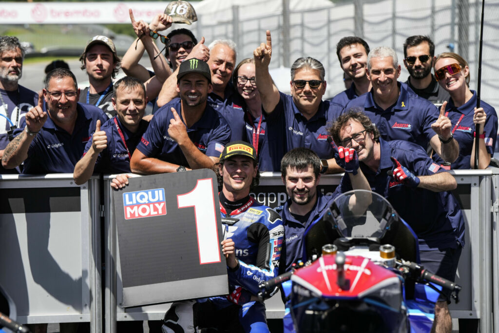 Joe Roberts (holding #1 board) celebrates with his team in Parc Ferme. Photo courtesy OnlyFans American Racing Team.