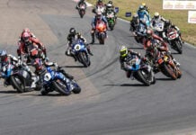 The start of MotoAmerica Superbike Race One at Brainerd in 2023, seconds before Cameron Beaubier (6) set off a chain-reaction crash that affected Jake Gagne (1), PJ Jacobsen (99), Mathew Scholtz (11), and their Championship aspirations. Photo by Brian J. Nelson.