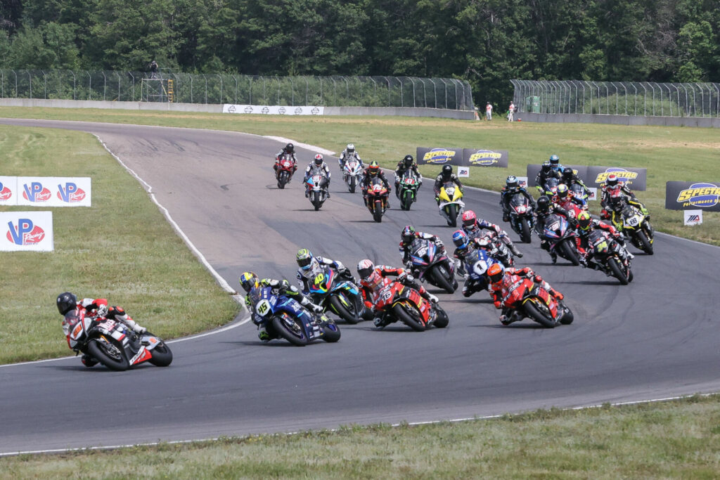 Bobby Fong (50) got the jump on the field at the start of the Steel Commander Superbike race at Brainerd International Raceway on Sunday and was never headed. Cameron Petersen (45) and the rest of the pack give chase. Photo by Brian J. Nelson.