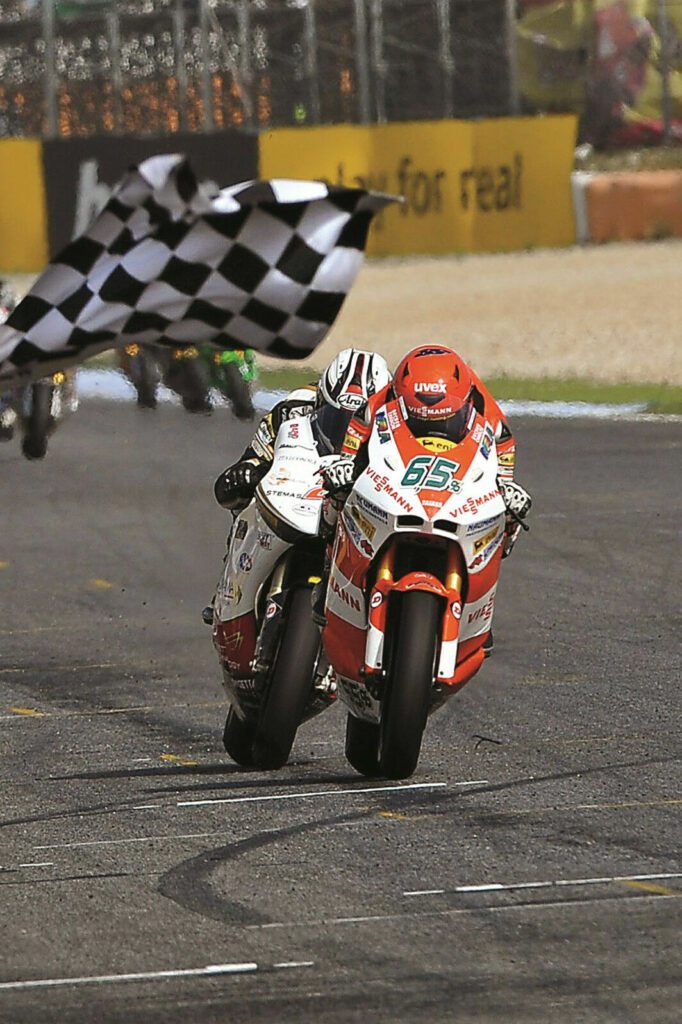 Stefan Bradl (65) wins the Moto2 race at Estoril in 2010. Photo by DPPI.