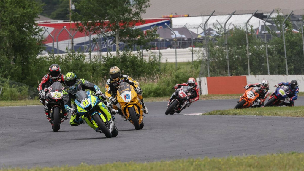 Mathew Scholtz (11) leads PJ Jacobsen (15) and Teagg Hobbs (79) in Supersport action at Brainerd International Raceway on Sunday. Photo by Brian J. Nelson.