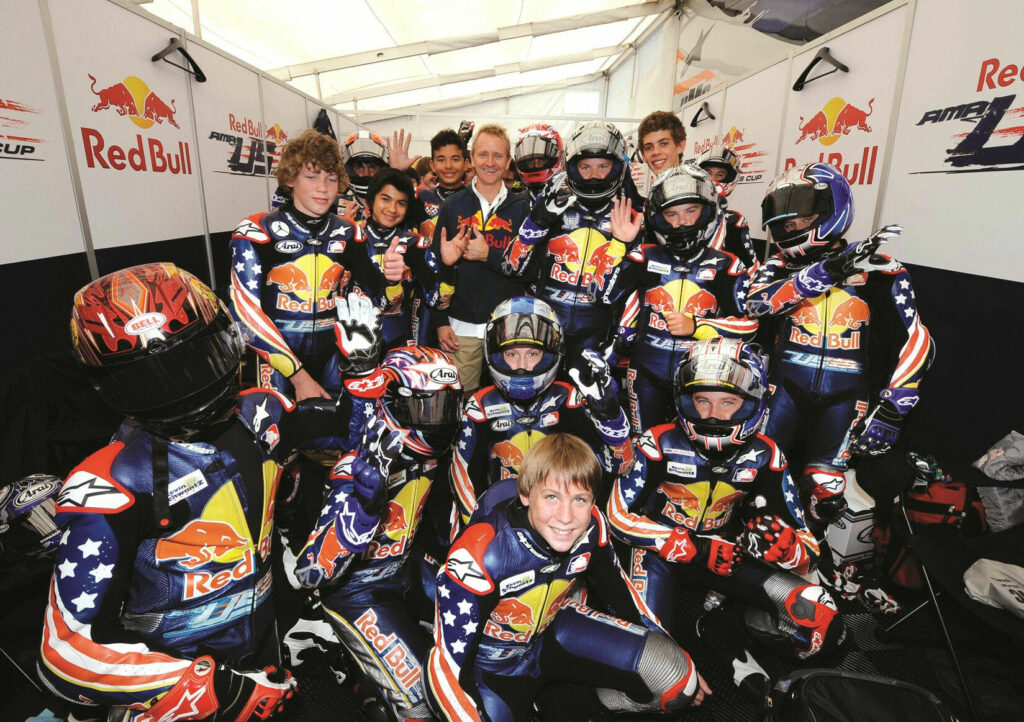 Kevin Schwantz poses with the Red Bull AMA Rookies Cup kids at Mazda Raceway Laguna Seca, 2008. Photo by DPPI Media.