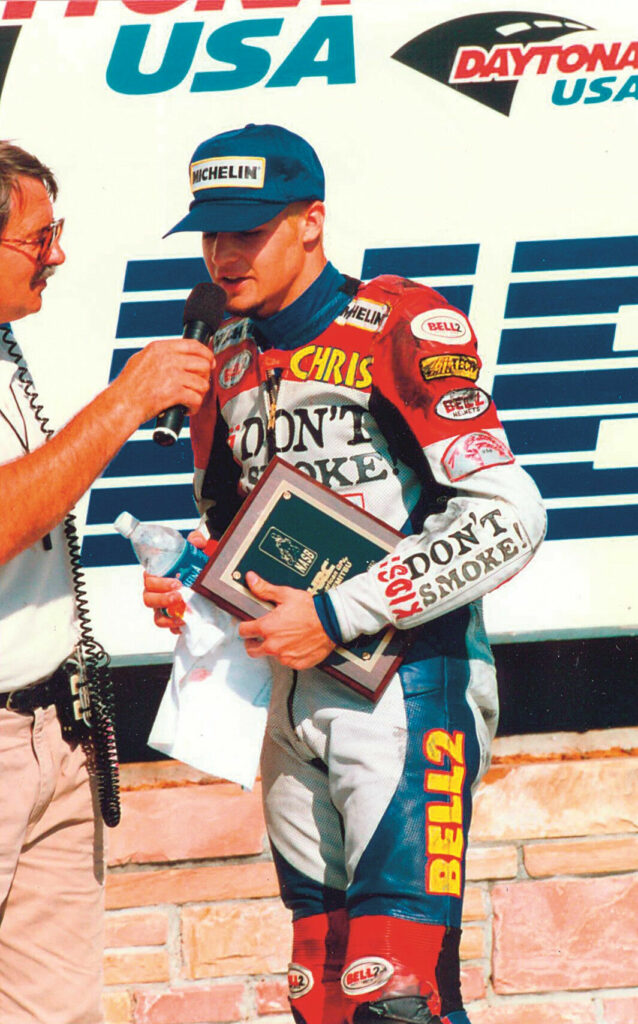 Chris Ulrich being interviewed by Richard Chambers after qualifying on pole and finishing second in a NASB 125cc Grand Prix race at Daytona International Speedway, 1997.