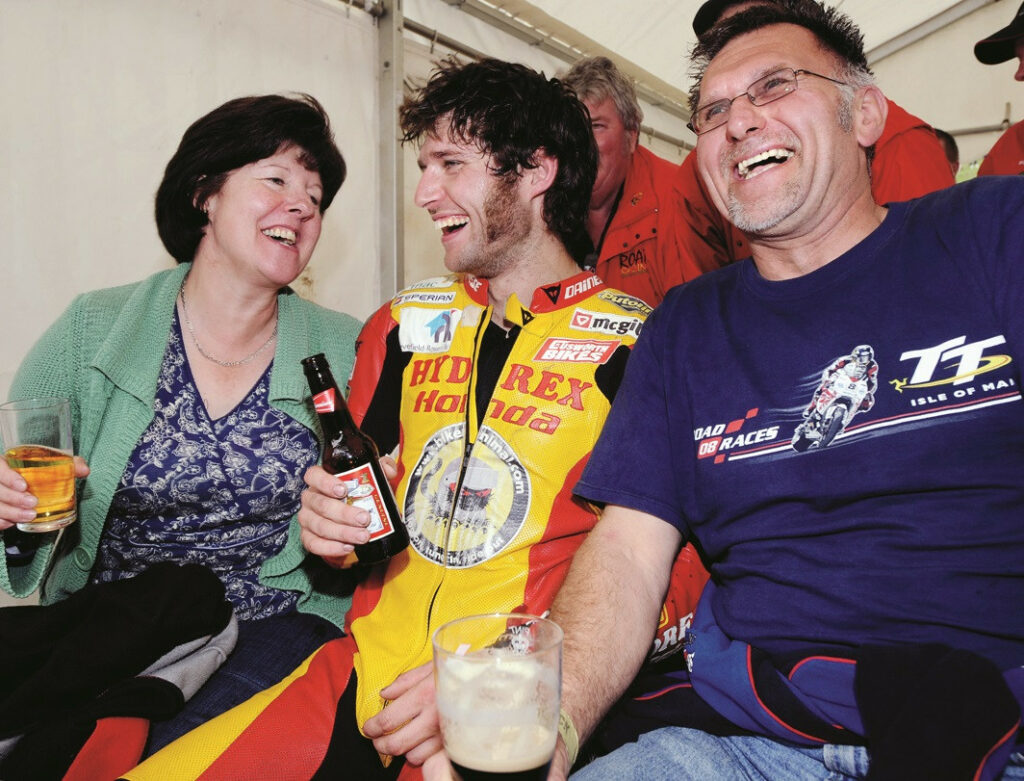 Guy Martin celebrates a 2008 win on the public-roads course at Scarborough with his mother Rita and father Ian. Photo by Stephen Davison.