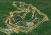 An aerial view of Ozarks International Raceway in its early days. The long building in the interior is a 58-day garage, and the paved area around it now connects the inner and outer sections, serving as a paddock for both. The track runs in a clockwise direction. Photo courtesy ASRA and Evolve GT.