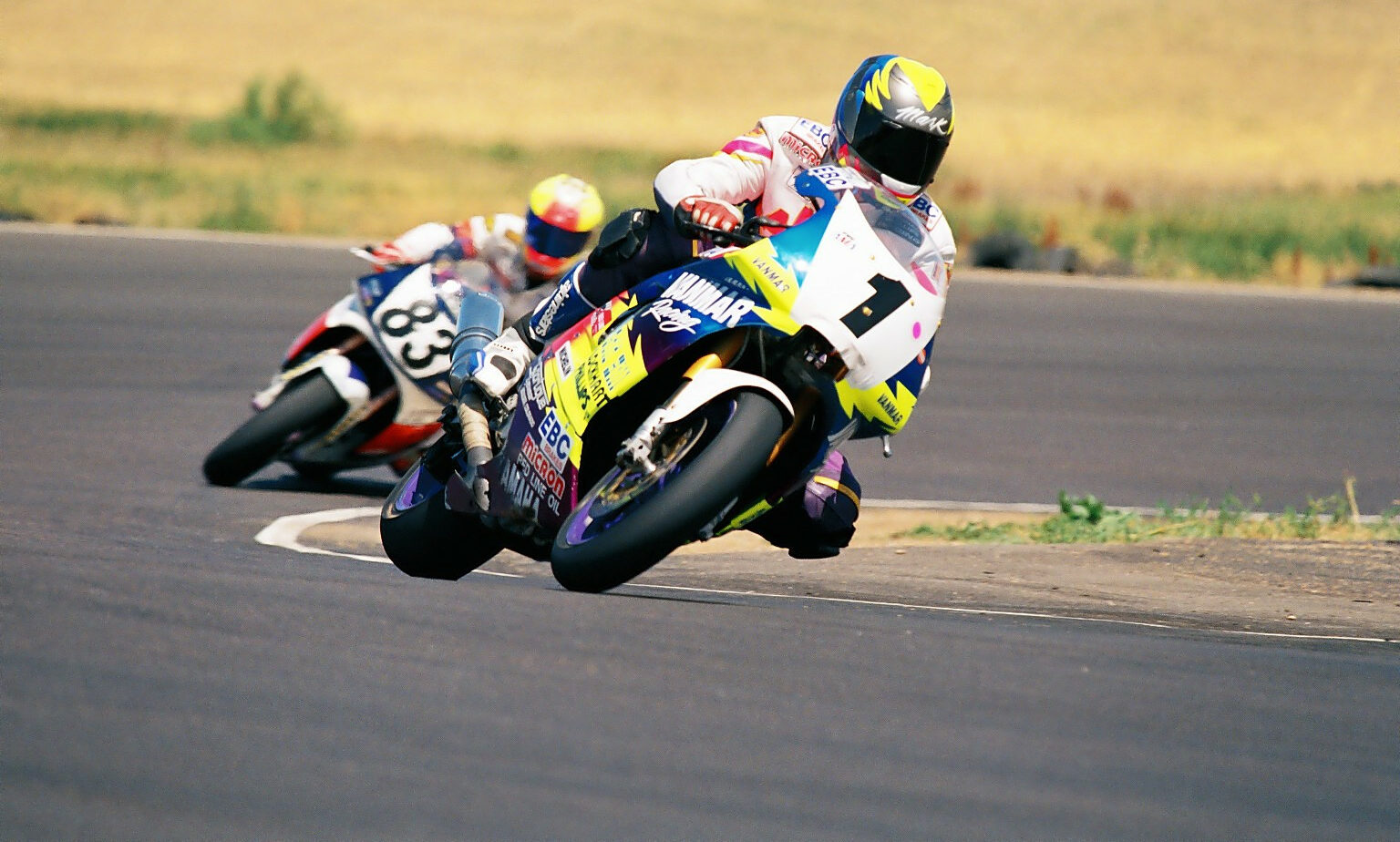 Mark Schellinger (1) leading Doug Vickery (83) during a MRA race in 1995 at Second Creek Raceway. Photo by John Weiland, courtesy Colorado Motorsports Hall of Fame.