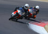 Dave Roper (7) and Walt Fulton (63) at speed at WeatherTech Raceway Laguna Seca. Photo by etechphoto.com, courtesy AHRMA.