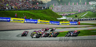 Trackhouse Racing’s Miguel Oliveira leads the first lap of a MotoGP race at the Sachsenring, in Germany, riding a 2024 Aprilia RS-GP. Photo by Gigi Soldano/DPPI Media.  