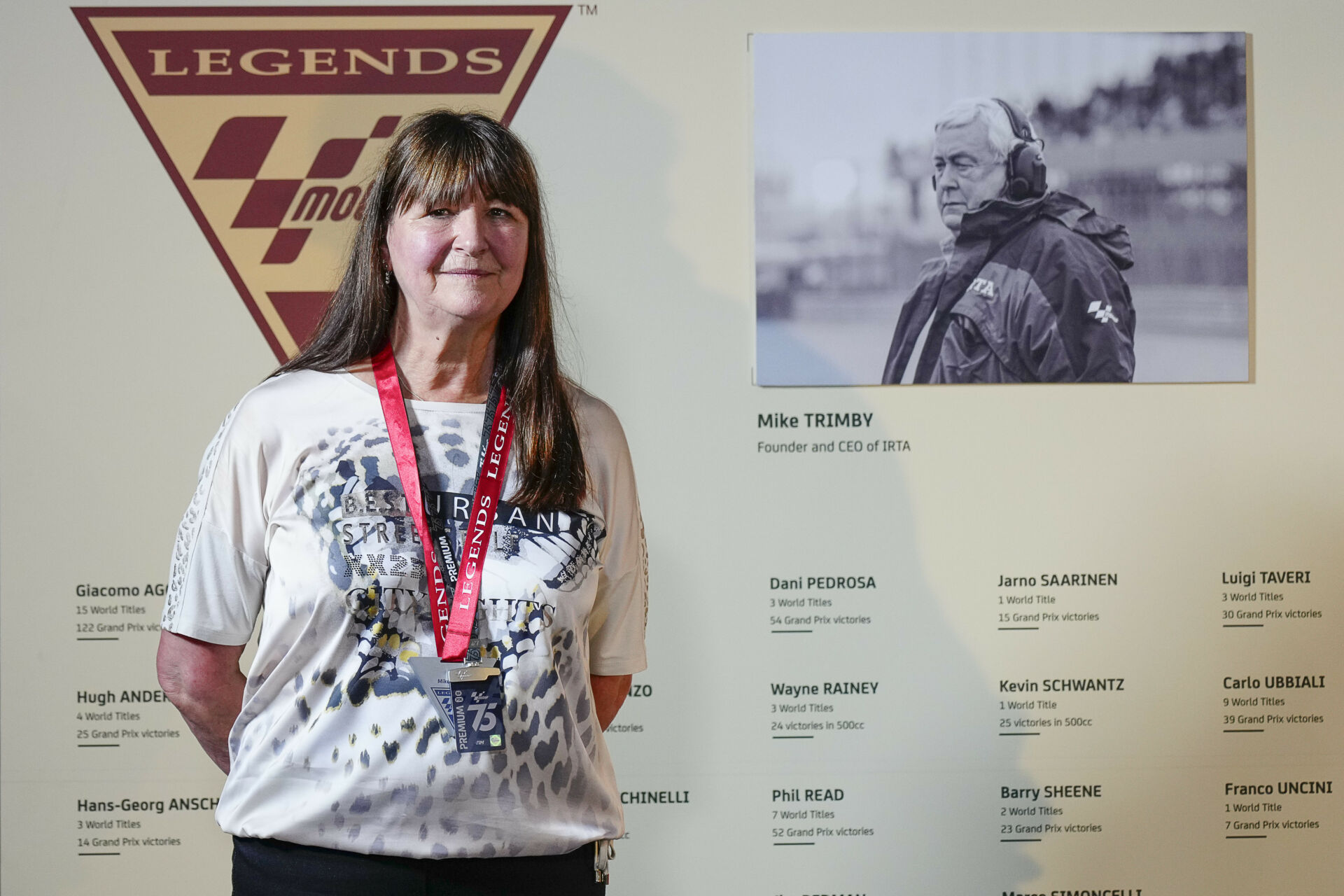 Irene Trimby, the widow of IRTA founder and CEO Mike Trimby, wearing his MotoGP Legends medal. Photo courtesy Dorna.