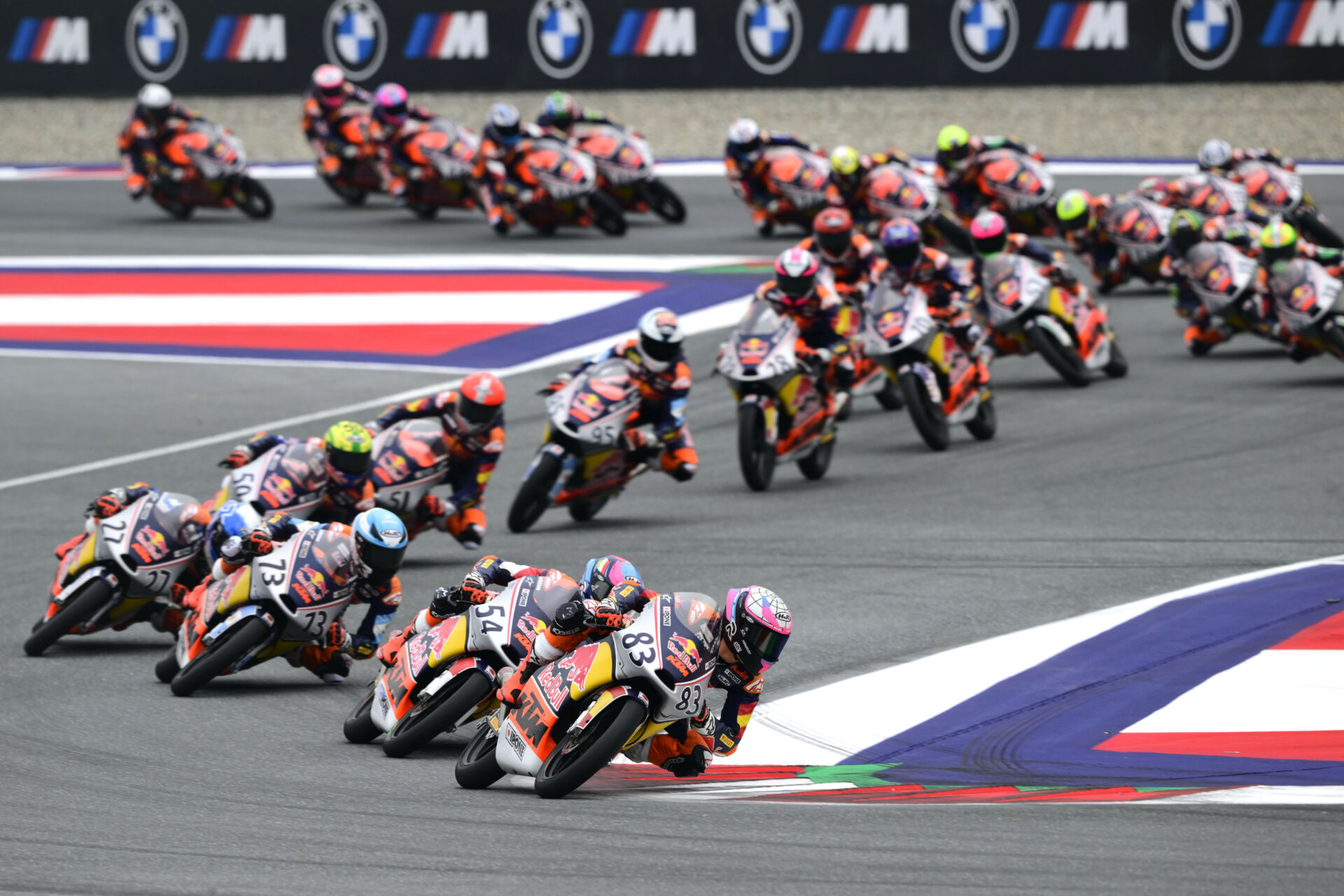 Alvaro Carpe (83) leads the start of Race Two at the Red Bull Ring. Photo courtesy Red Bull MotoGP Rookies Cup.