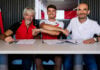 Fabio Di Giannantonio (center) with Ducati CEO Claudio Domenicali (right) and Ducati Corse General Manager Gigi Dall'Igna (left). Photo courtesy Ducati.