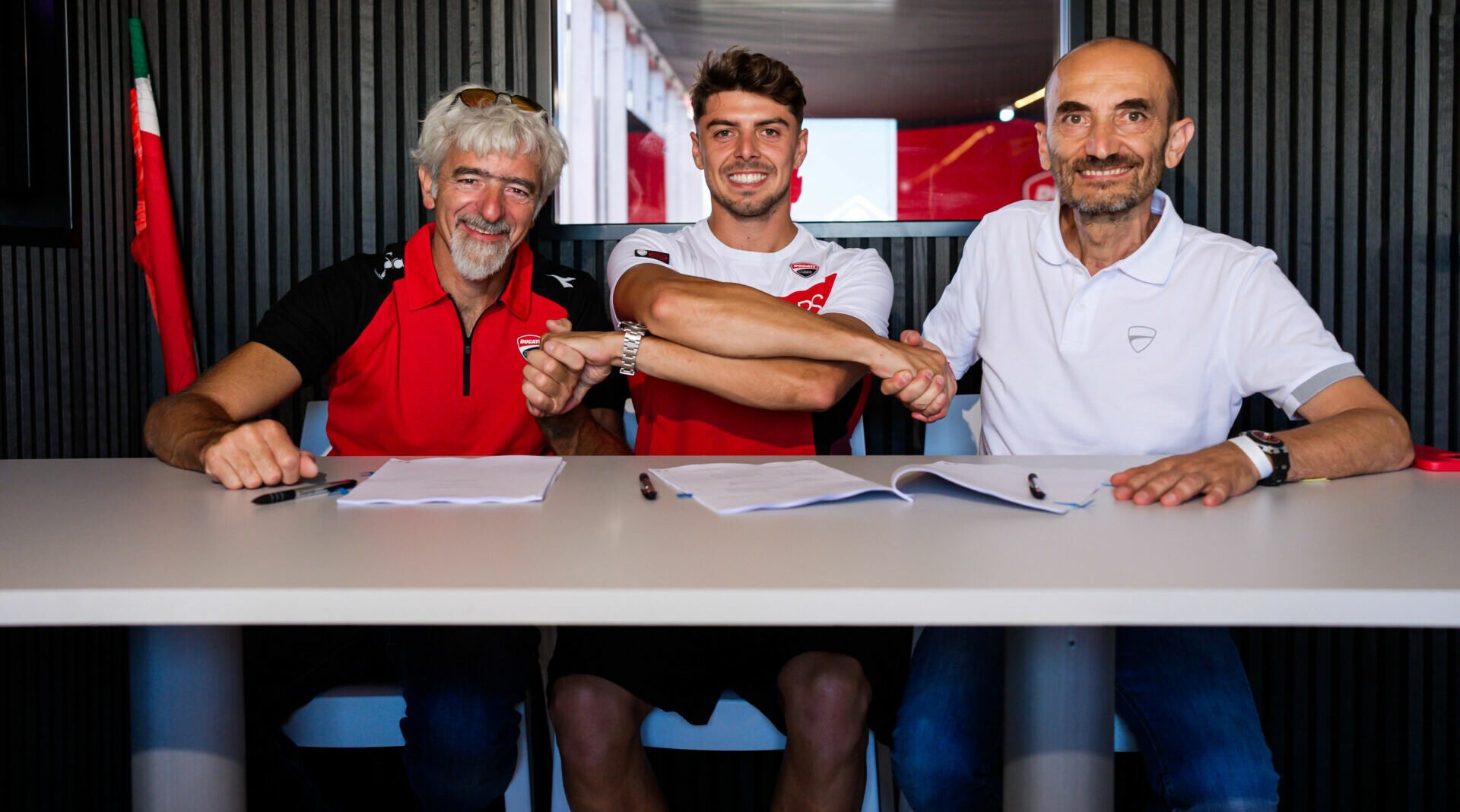 Fabio Di Giannantonio (center) with Ducati CEO Claudio Domenicali (right) and Ducati Corse General Manager Gigi Dall'Igna (left). Photo courtesy Ducati.