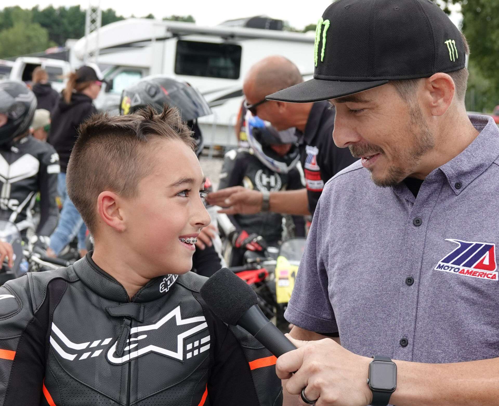 Jase Dill is all smiles while being interviewed by Roger Hayden after winning Saturday’s GP 160 race one at Road America. Photo by Larry Lawrence, courtesy MotoAmerica.