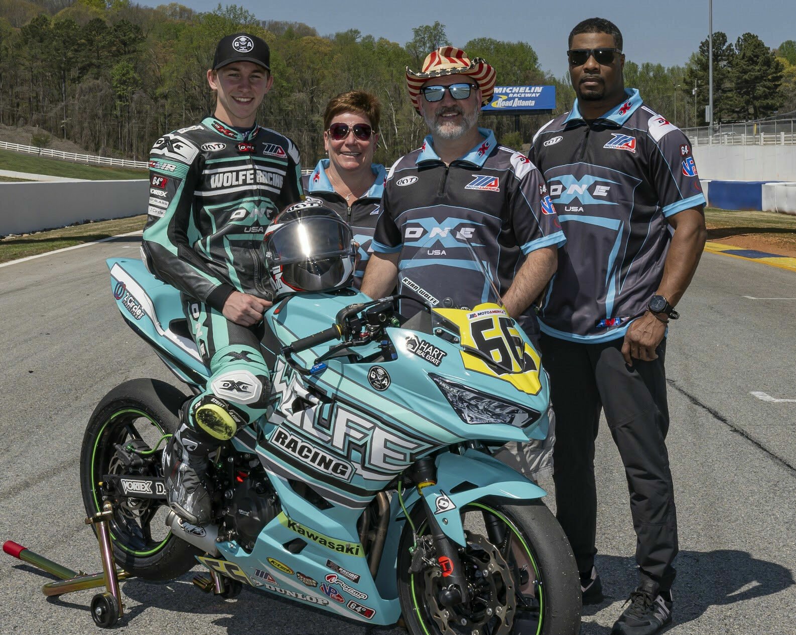 Wolfe Racing Team (from left) Ryan Wolfe, Erika Wolfe, David Wolfe, and crew chief Dakari Harris. Photo by Highside Photo, courtesy Wolfe Racing Team.