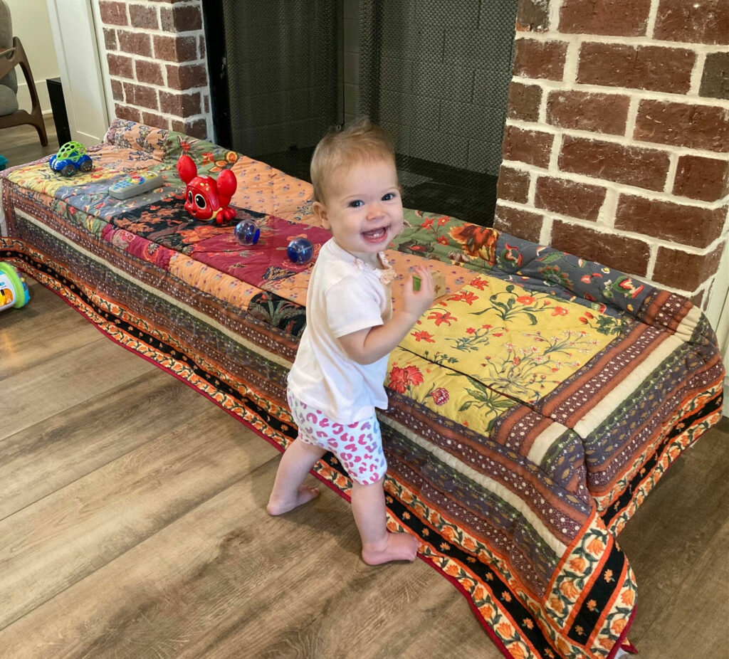 Olivia Grace "OG" Barnes's mother Anne Barnes feels that interacting with her Strider balance bike allowed her to advance to "cruising" around the house. Photo by Anne Barnes.