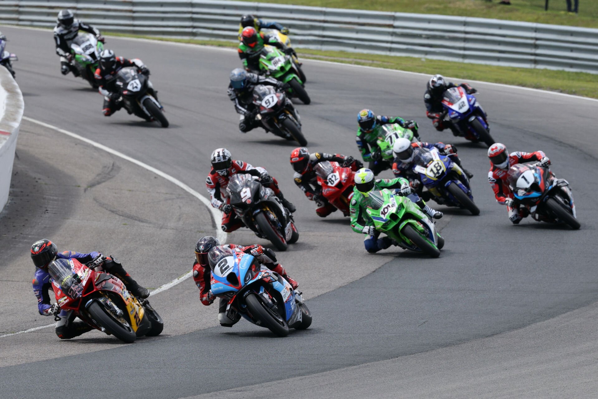 Eventual winner Alex Dumas (23) leads the GP Bikes Pro Superbike field through turn one at the start of Saturday's race one at Canadian Tire Motorsport Park. Ben Young (1) worked his way from ninth on the grid to finish second ahead of Sam Geurin (2). Photo by Rob O'Brien, courtesy CSBK.