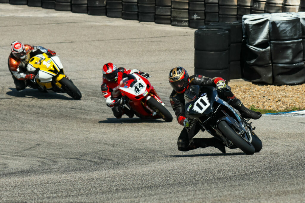 Brett Guyer (11) leads Tim Hogan (44) and Rick Doucette (1) at New Hampshire Motor Speedway. Photo by Sam Draiss, courtesy NEMRR.