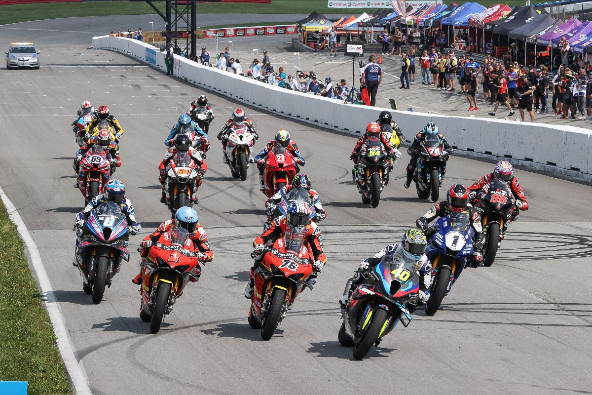 Sean Dylan Kelly (40), Loris Baz (76), Josh Herrin (2), Cameron Beaubier (6), Jake Gagne (1) and the rest of the MotoAmerica Superbike field drop the hammer at the start of Saturday's race one. Photo by Brian J. Nelson.