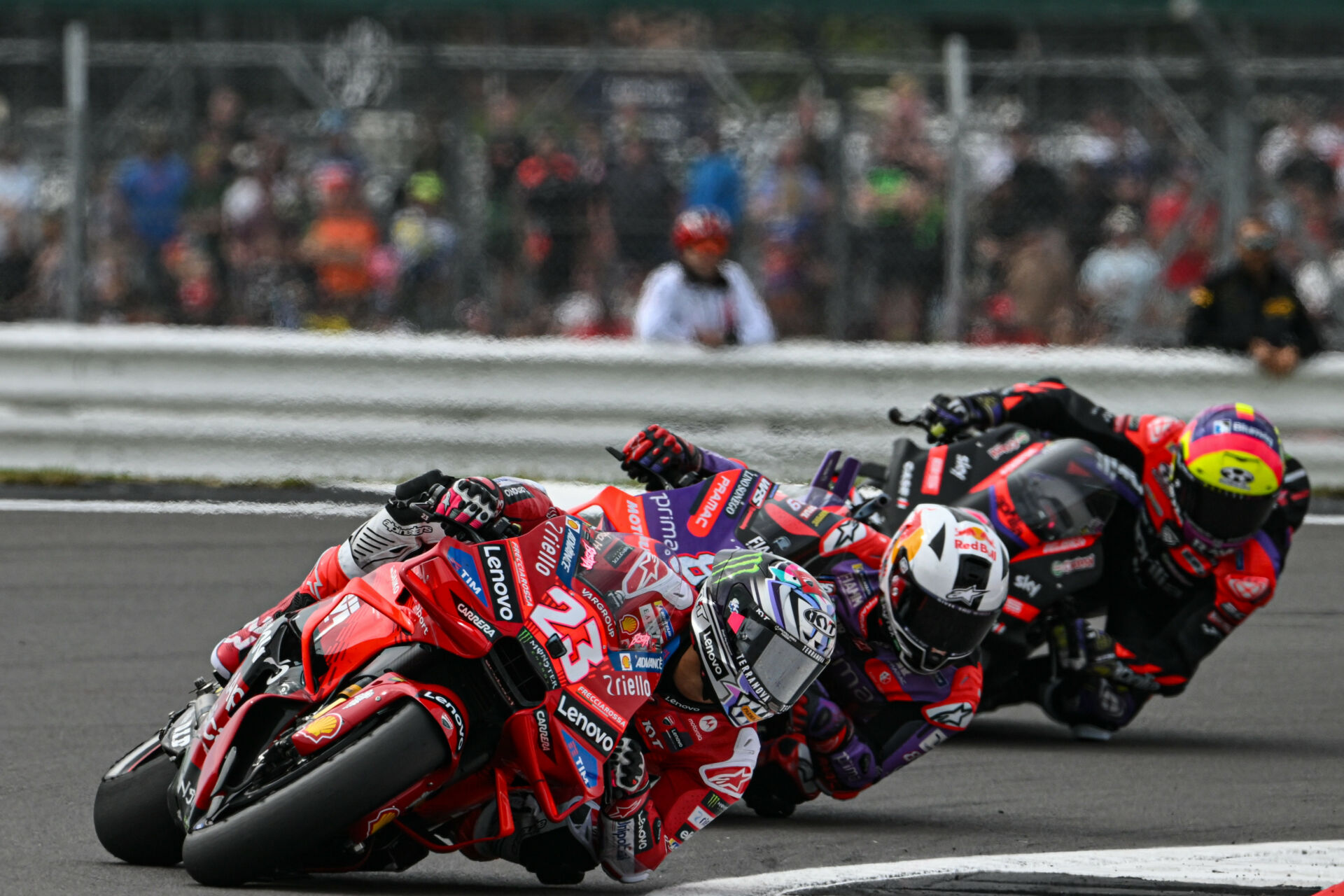 Enea Bastianini (23) leads Jorge Martin and Aleix Espargaro Saturday at Silverstone. Photo courtesy Dorna.