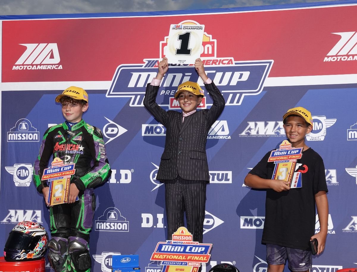 Jase Dill dressed like a champion on the GP 160 podium. Dill (center) was joined on the podium by second-placed Connor Raymond (left) and third-placed Gabriel Datis (right). Photo by Larry Lawrence, courtesy MotoAmerica.