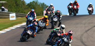 Geoff May (99), Stefano Mesa (37), Hayden Gillim (77X), Chris Fillmore (11R), Rennie Scaysbrook (33X), Gus Rodio (296), and Nate Kern (9T) during the 2023 AHRMA Pro Challenge race. Photo by etechphoto.com, courtesy AHRMA.