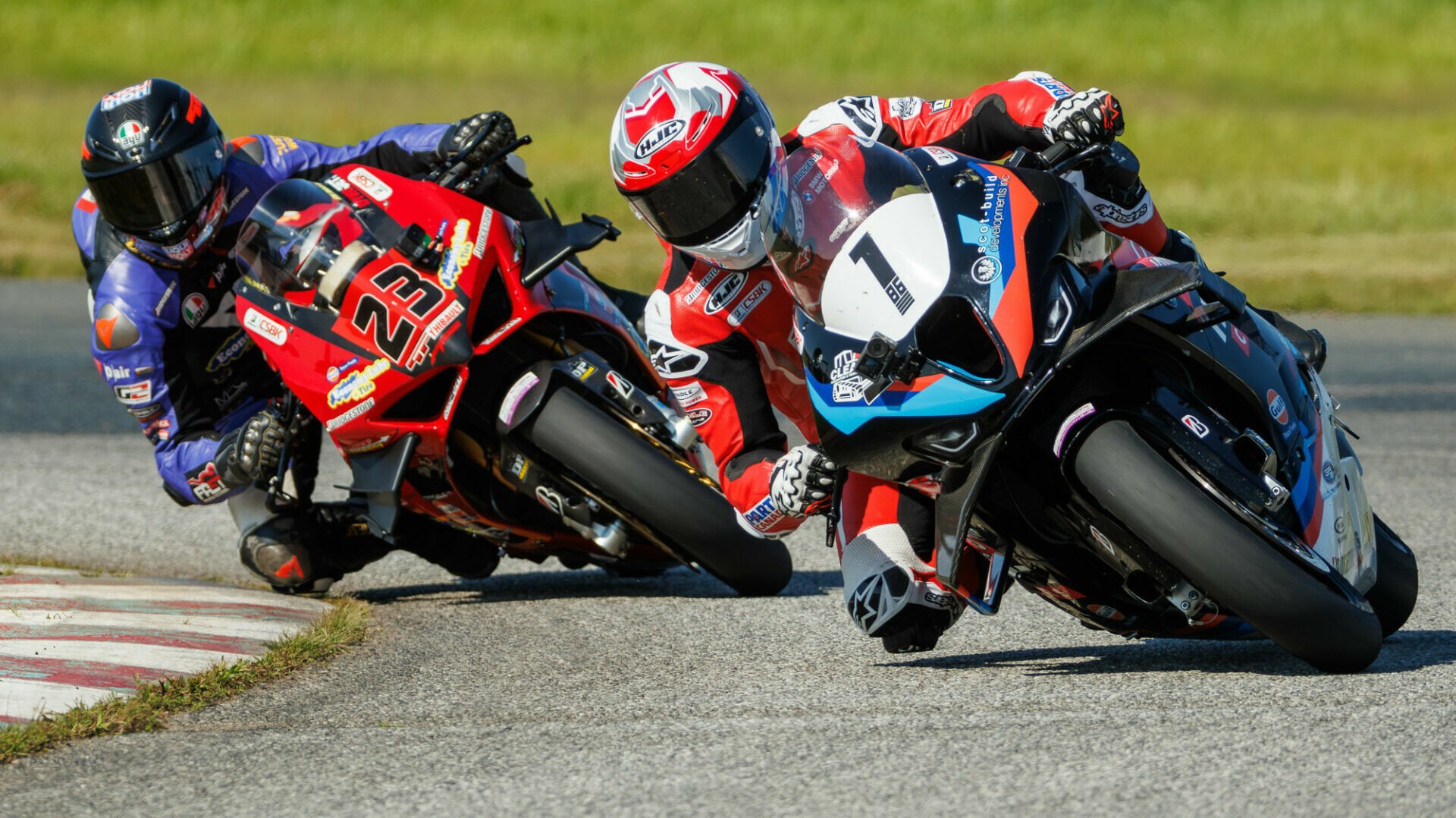 Last lap action as Ben Young (1) leads Alex Dumas (23) through the last corner at Shannonville Motorsport Park to take the win in the final GP Bikes Pro Superbike race of the 2024 CSBK season. Photo by Ron Scheffler, courtesy CSBK.