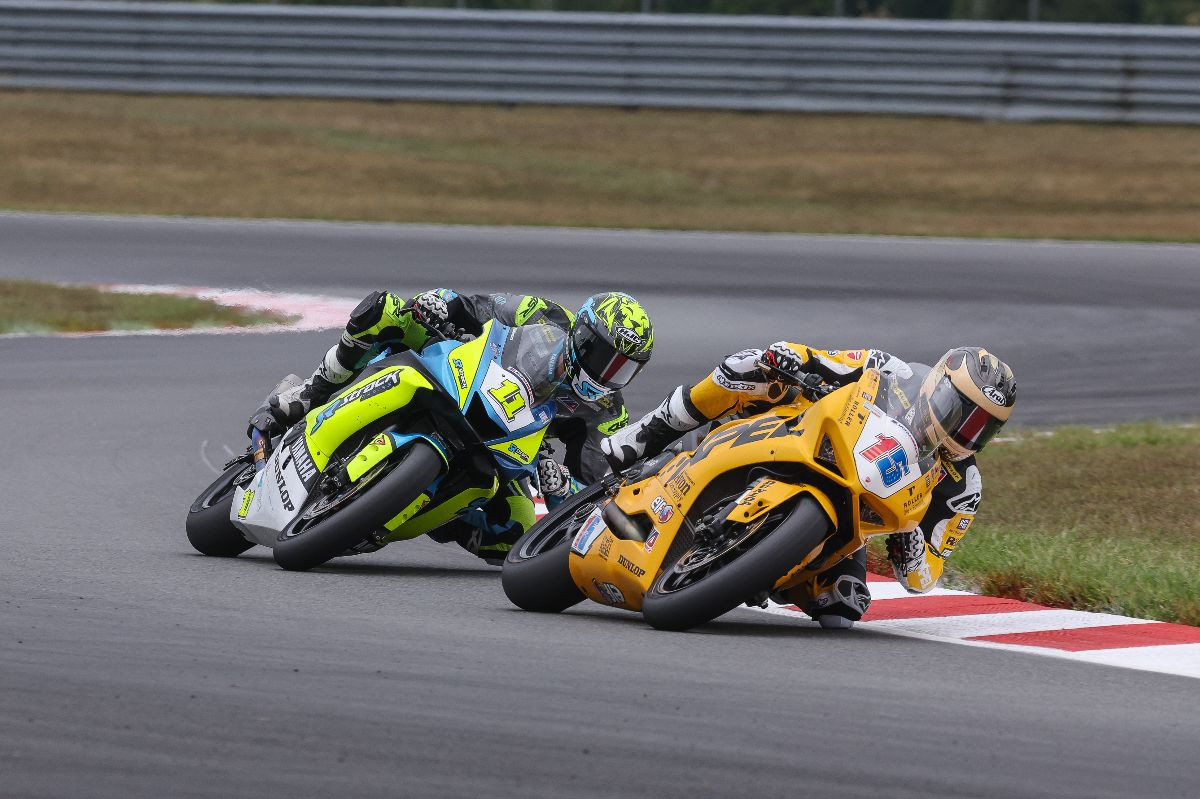 PJ Jacobsen (15) and Mathew Scholtz (11) were at it again in Supersport class action at NJMP. Jacobsen won with Scholtz finishing second. Photo by Brian J. Nelson