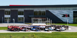 The Rahal Letterman Lanigan Racing teams pose in front of their race shop in Zionsville, Indiana, in 2023. Photo courtesy Rahal Letterman Lanigan Racing.