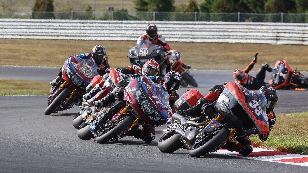 Kyle Wyman (33) leads Troy Herfoss (17) and Rocco Landers (hidden) while Hayden Gillim (1) crashes in the background. Landers took the win over Herfoss and Wyman. Photo by Brian J. Nelson.