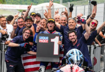 Only Fans American Racing Team's Joe Roberts with John Hopkins (wearing Monster hat) and Team Co-Owner Eitan Butbul (with sunglasses on top of his head), after Roberts won the Moto2 race at Mugello in June. Photo courtesy OnlyFans American Racing Team.