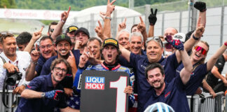 Only Fans American Racing Team's Joe Roberts with John Hopkins (wearing Monster hat) and Team Co-Owner Eitan Butbul (with sunglasses on top of his head), after Roberts won the Moto2 race at Mugello in June. Photo courtesy OnlyFans American Racing Team.