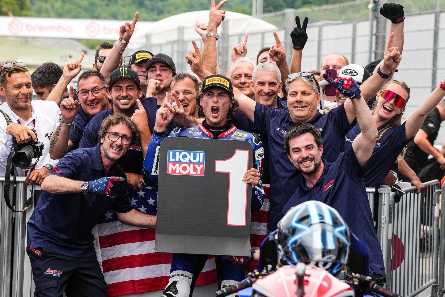 Only Fans American Racing Team's Joe Roberts with John Hopkins (wearing Monster hat) and Team Co-Owner Eitan Butbul (with sunglasses on top of his head), after Roberts won the Moto2 race at Mugello in June. Photo courtesy OnlyFans American Racing Team.