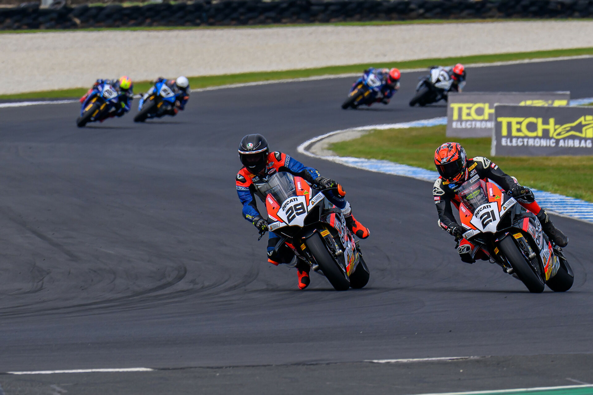 Harrison Voight (29) makes his decisive move on Josh Waters (21) in AMA Warehouse Superbike Race One at Phillip Island. Photo by RBMotoLens, courtesy ASBK.