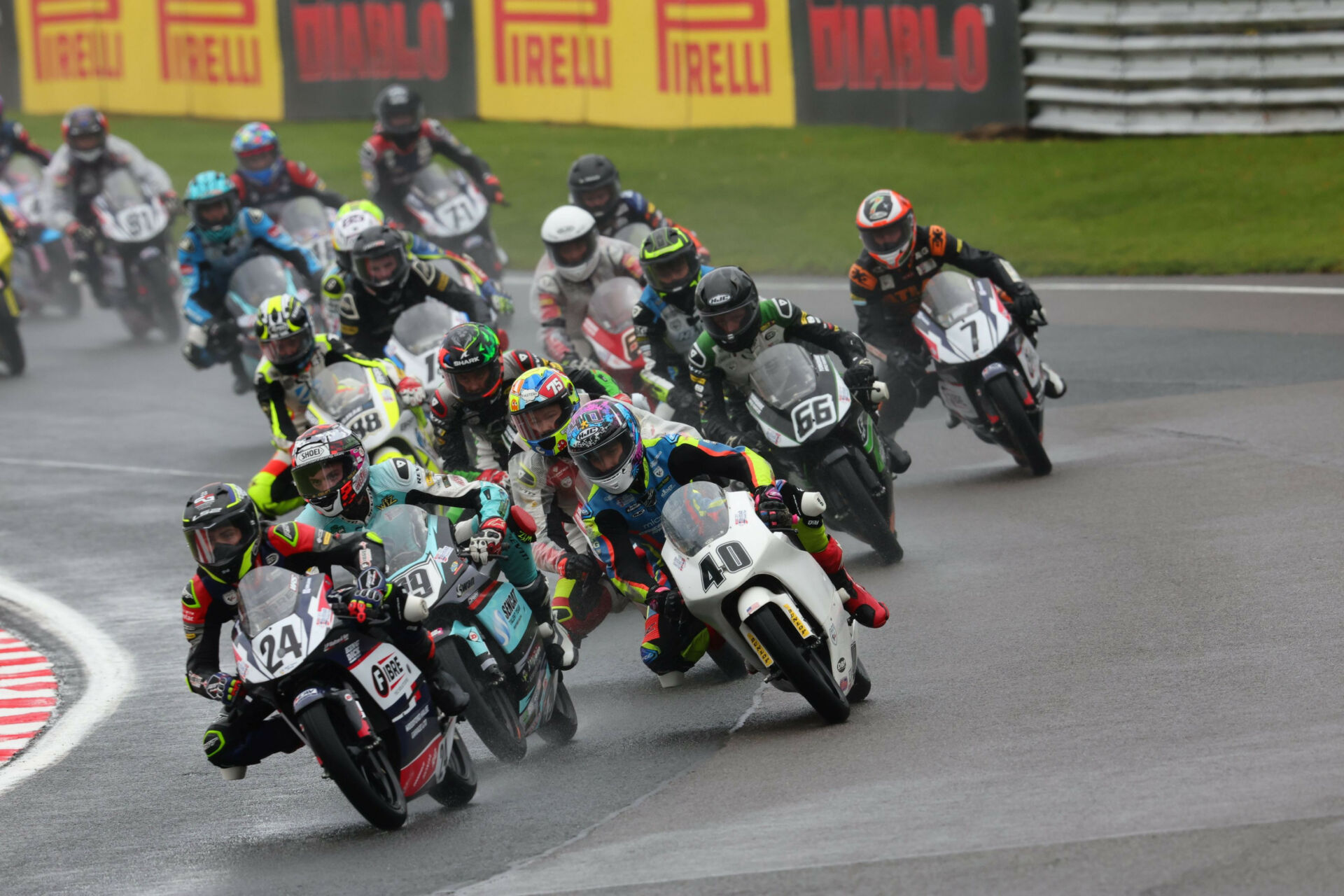 Ryan Frost (24) leads Lucas Brown (29), Julian Correa (40), and the rest of the field early in wet Race Two. Photo courtesy BTC.